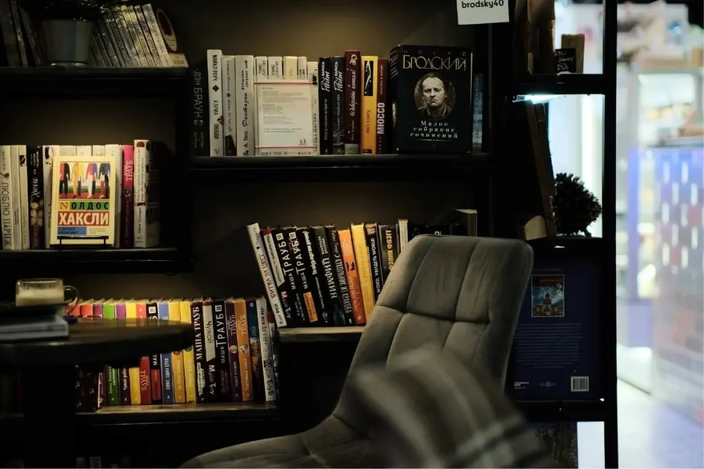 open back bookshelf used as a studio apartment room divider