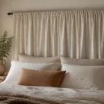 Headboard Ideas Without Drilling 7 DIY headboard made from a tension rod and draped fabric panel