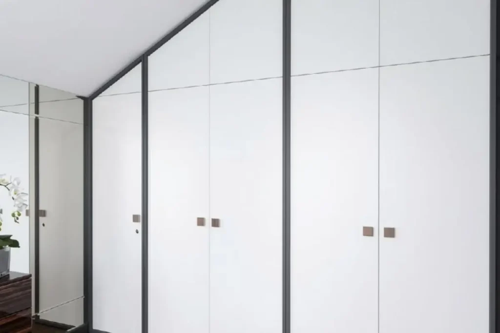 15 best two-colour combinations for a wardrobe in a small bedroom 13 charcoal grey accents on pure white wardrobe doors in compact bedroom.