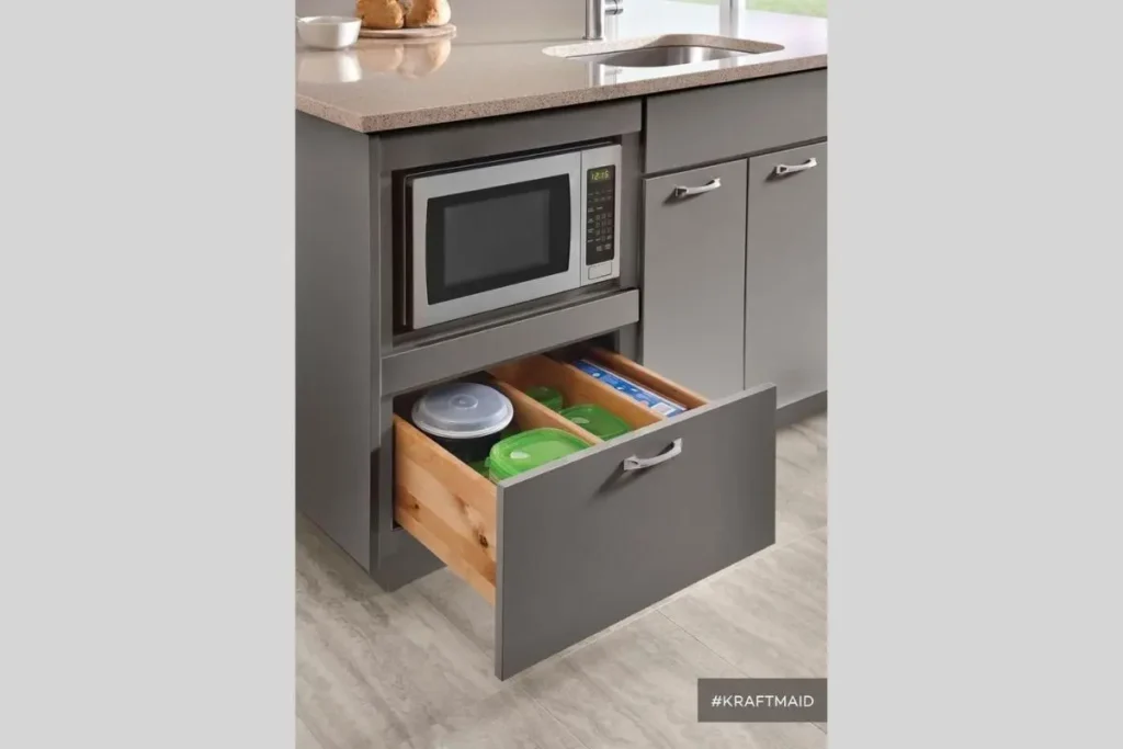 Where to put a microwave in a small kitchen with no counter space? 5 Built-in microwave integrated into a lower base cabinet as an idea for where to put microwave in small kitchen with no counter space.