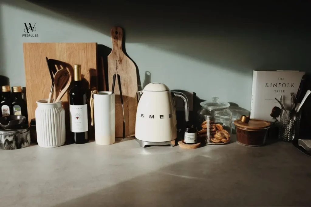 minimalist small kitchen on a tight budget featuring organized wooden countertop with electric kettle.