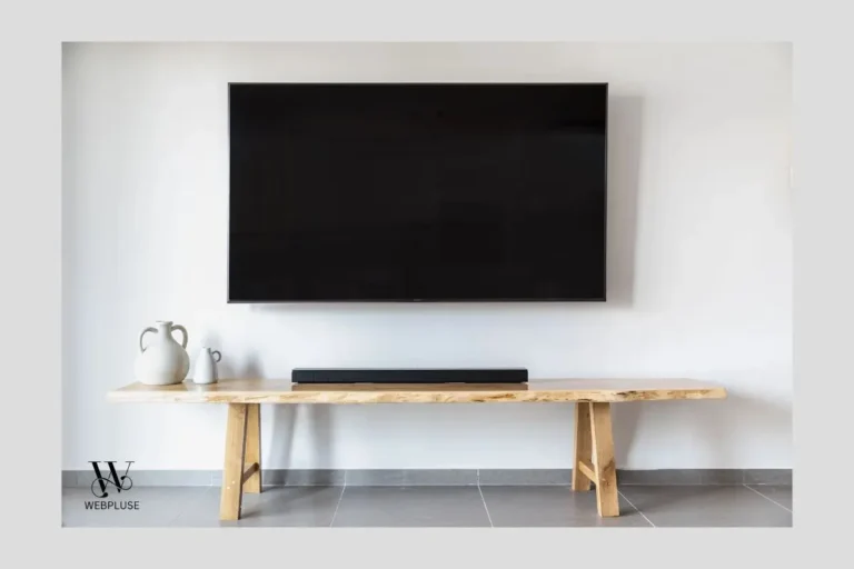 small living room decor ideas without TV wall mount featuring low wooden bench credenza.